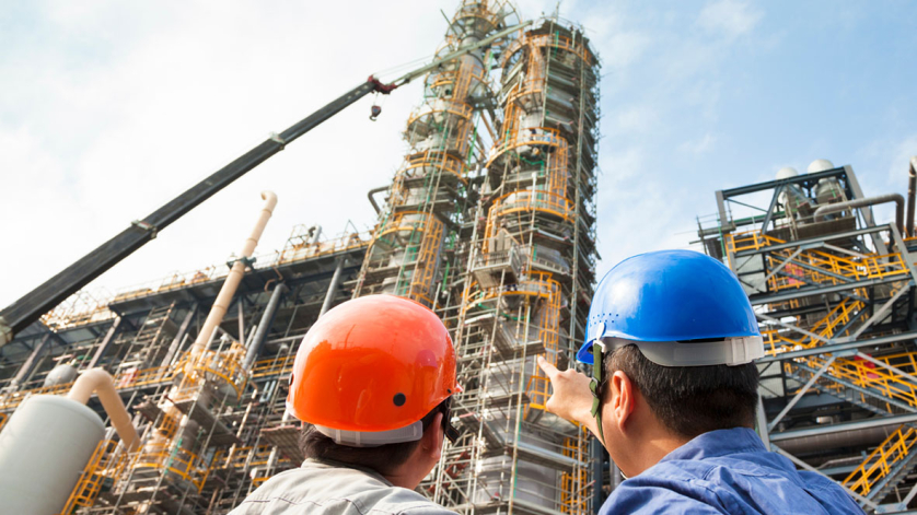 two Factory workers discussion and pointing for inspection